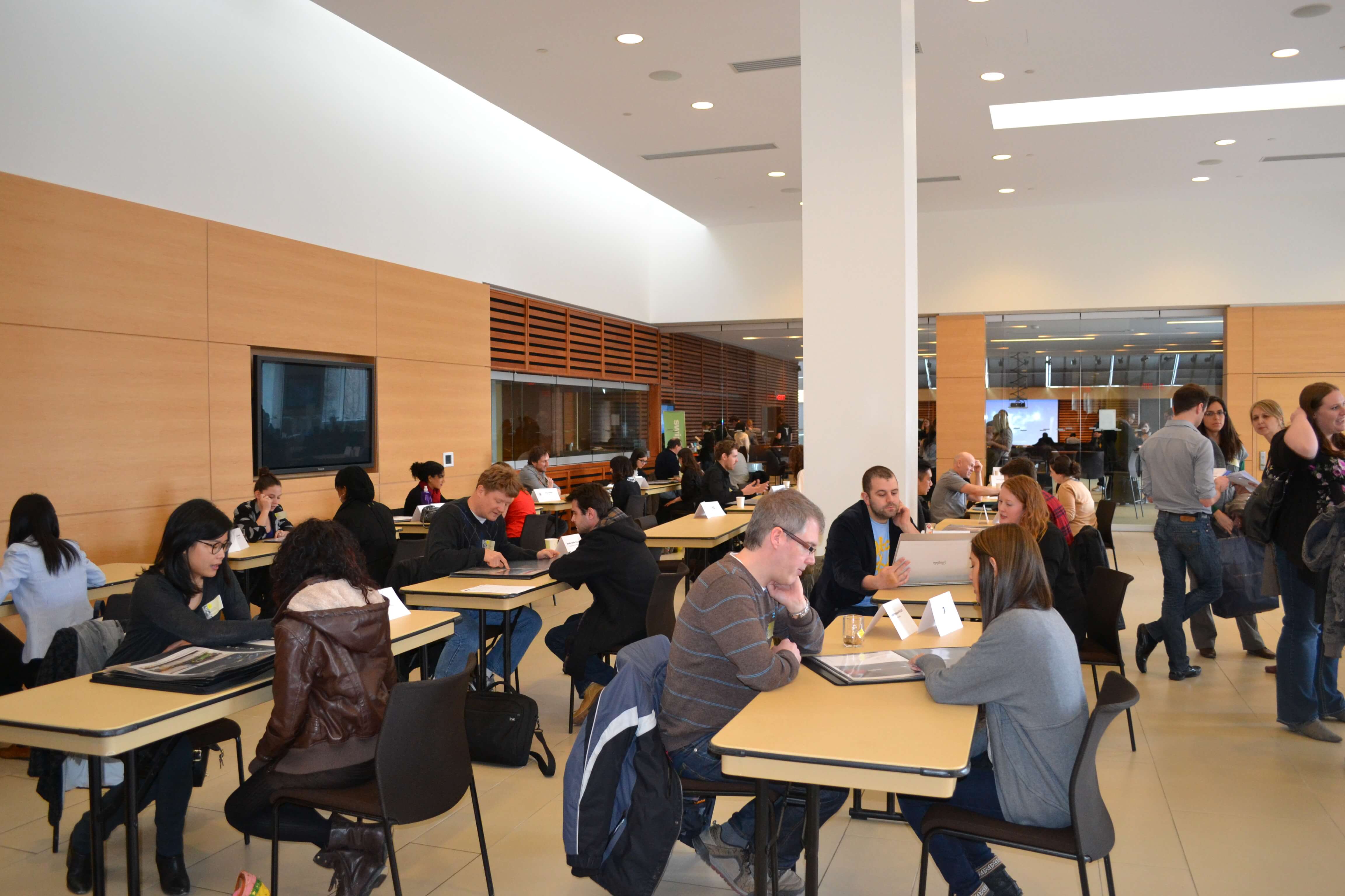 An image of the Toronto Reference Library full of registered graphic designers.